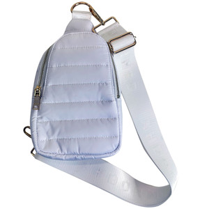 Front view of ah.dorned Eliza Quilted Puffy Sling Bag in the color White.