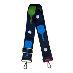 Front view of the ah.dorned SPORT Adjustable Bag Strap featuring fun pickleball pattern Navy Multi Paddles.